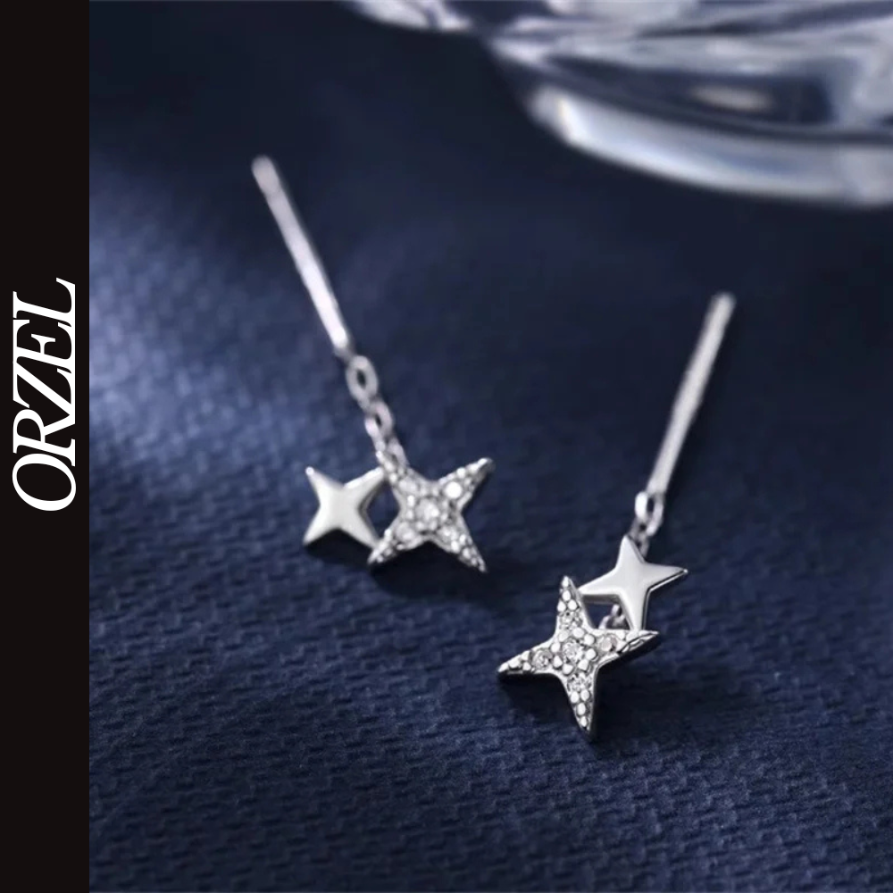 Boucles d’oreilles femme – Pompon et étoile en argent 925.