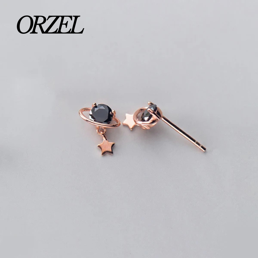 Boucles d’oreilles planète noire en argent 925 avec cristal scintillant.