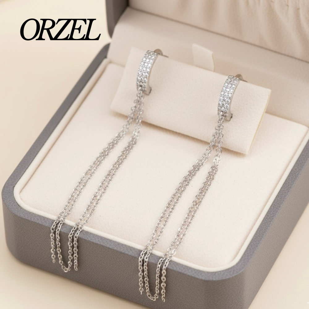 Boucles d’oreilles longues à pampilles en argent 925 avec zircone scintillante.