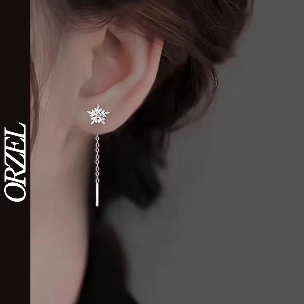 Boucles d’oreilles femme en argent 925 – Flocon de neige avec pompon long.