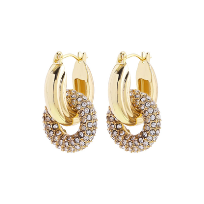 Boucles d’oreilles torsadées – style punk chic avec zircons brillants.