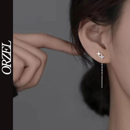 Boucles d’oreilles femme – Pompon et étoile en argent 925.