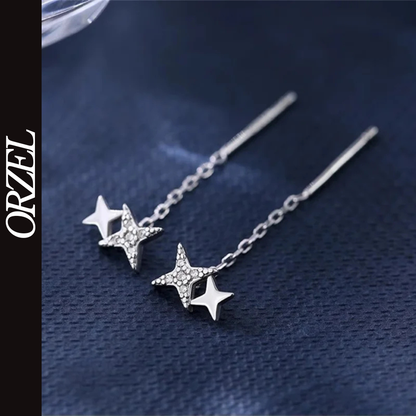 Boucles d’oreilles femme – Pompon et étoile en argent 925.