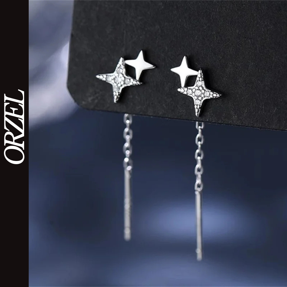 Boucles d’oreilles femme – Pompon et étoile en argent 925.