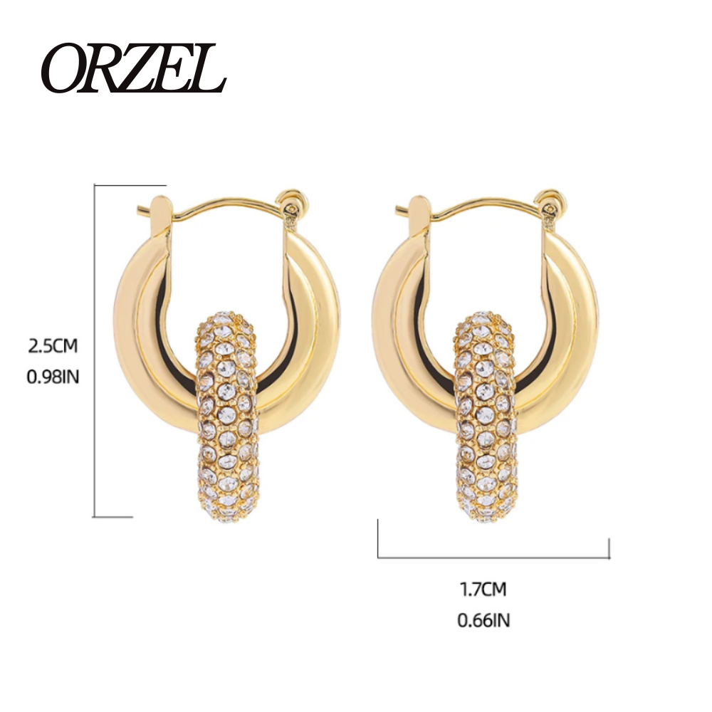 Boucles d’oreilles torsadées – style punk chic avec zircons brillants.