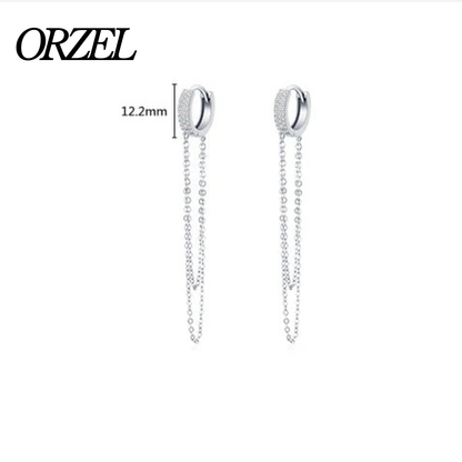 Boucles d’oreilles longues à pampilles en argent 925 avec zircone scintillante.