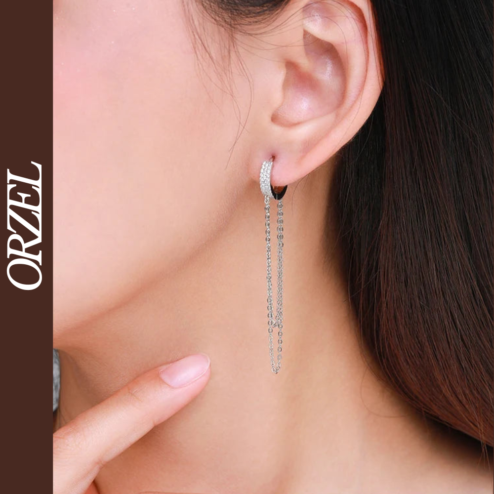 Boucles d’oreilles longues à pampilles en argent 925 avec zircone scintillante.