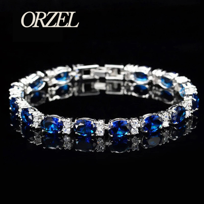 Bracelet porte-bonheur en argent 925 avec topaze colorée.