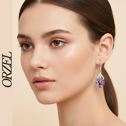 Boucles d’oreilles pendantes papillon en argent 925 avec pierres précieuses.