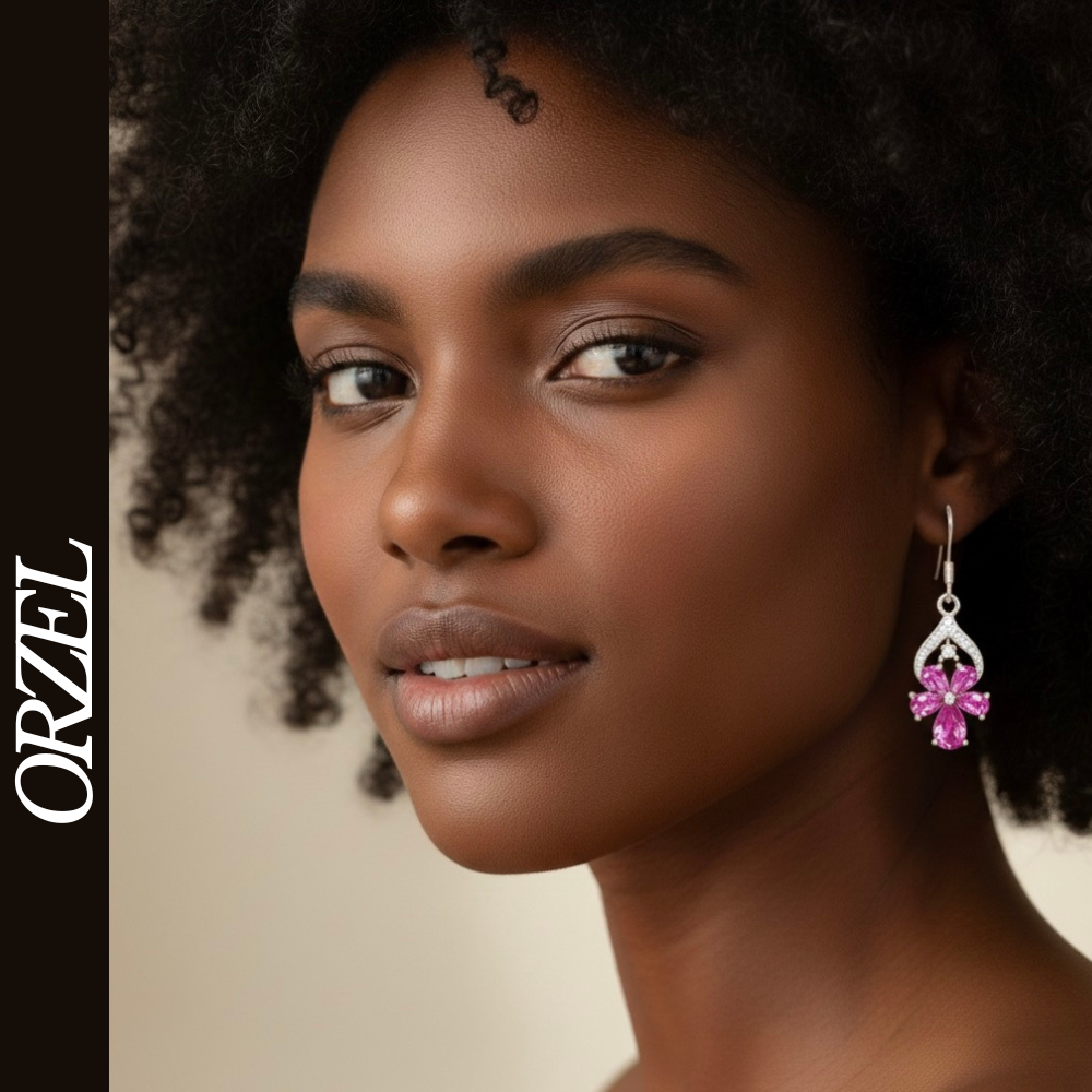 Boucles d’oreilles pendantes papillon en argent 925 avec pierres précieuses.