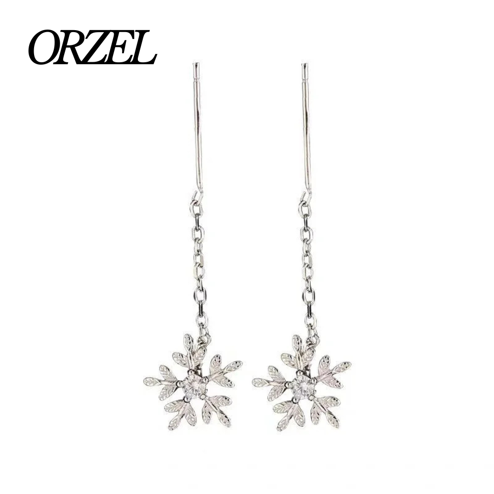 Boucles d’oreilles femme en argent 925 – Flocon de neige avec pompon long.