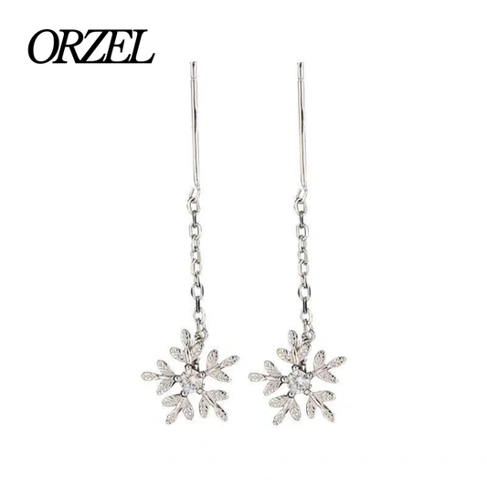 Boucles d’oreilles femme en argent 925 – Flocon de neige avec pompon long.