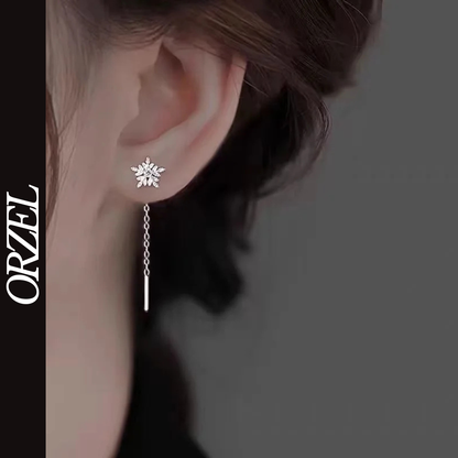 Boucles d’oreilles femme en argent 925 – Flocon de neige avec pompon long.