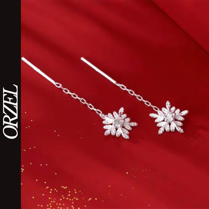 Boucles d’oreilles femme en argent 925 – Flocon de neige avec pompon long.