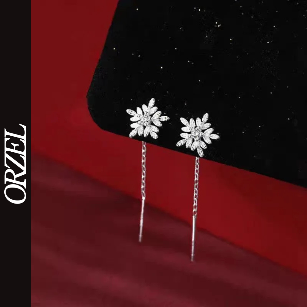 Boucles d’oreilles femme en argent 925 – Flocon de neige avec pompon long.