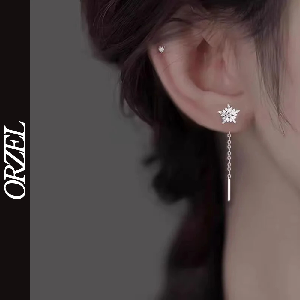 Boucles d’oreilles femme en argent 925 – Flocon de neige avec pompon long.