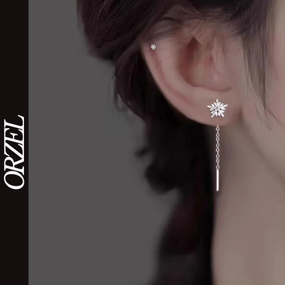 Boucles d’oreilles femme en argent 925 – Flocon de neige avec pompon long.