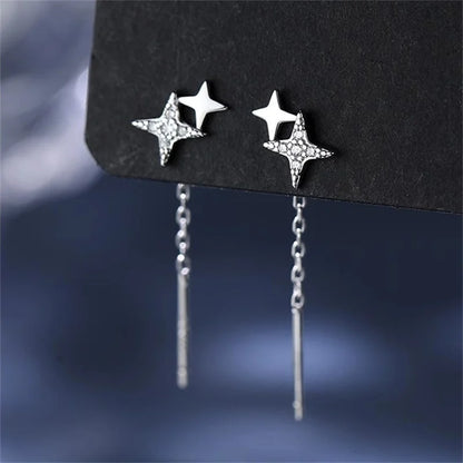 Boucles d’oreilles femme – Pompon et étoile en argent 925.