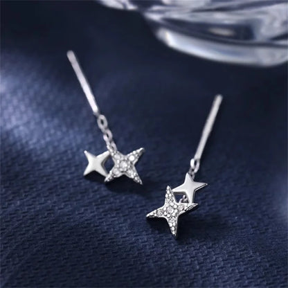 Boucles d’oreilles femme – Pompon et étoile en argent 925.