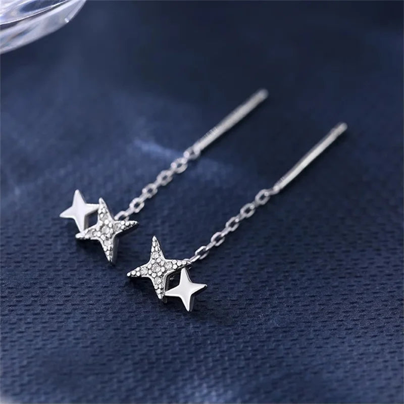 Boucles d’oreilles femme – Pompon et étoile en argent 925.