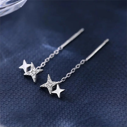 Boucles d’oreilles femme – Pompon et étoile en argent 925.