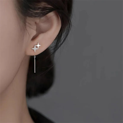 Boucles d’oreilles femme – Pompon et étoile en argent 925.